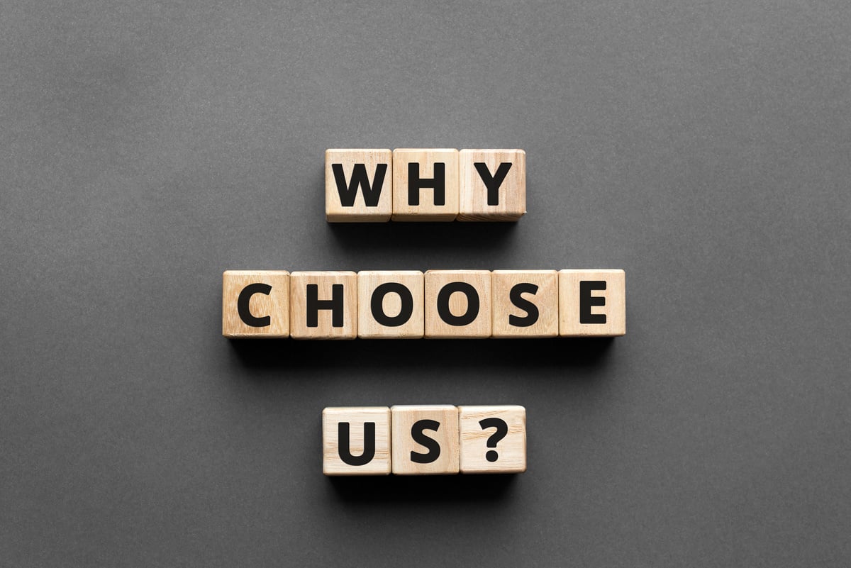 why choose us? - words from wooden blocks with letters